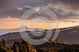 Sun Glows Over Oregon Mountains