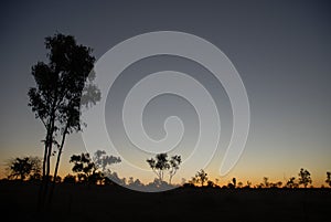 Sun going down in the Australian outback, night sky