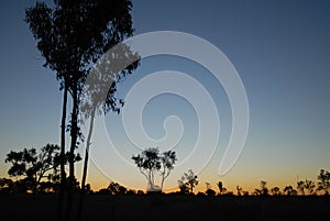 Sun going down in the Australian outback, night sky