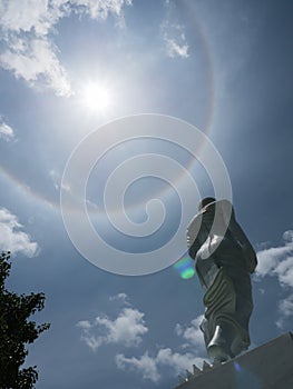 Sun halo and Buddha statue