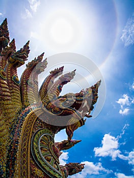 Sun halo on the king of Nagas and blue sky