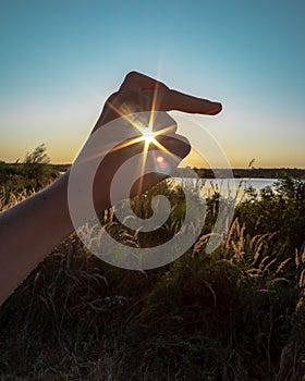 Sun in hand