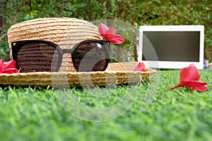 Sun hat sunglasses holiday background.