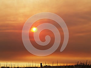 Sun Hidden Behing Smoke Filled Sky From Grass Fire