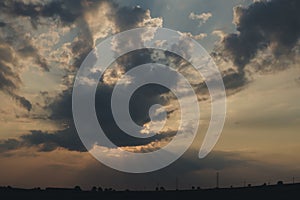 sun hiding behind cloud