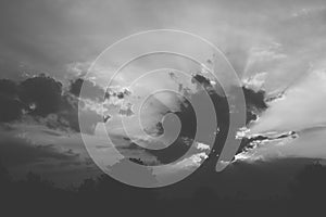 sun hiding behind cloud