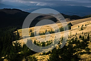 The sun illuminates the Carpathian mountain