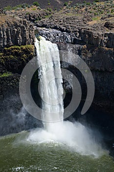 Sun illuminating Palouse Falls waterfall in central washington