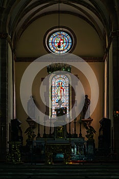 Sun light through the leaded pane in old majestic church