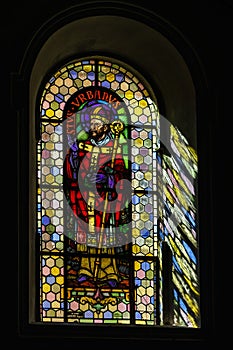 Sun light through the leaded pane in old majestic church