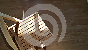 Sun light shine on the wooden chair.