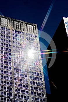 Sun lighting up tall building