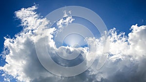 Sun lights rays in grey clouds