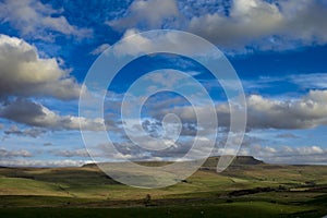 Sun lights up clouds around penyghent