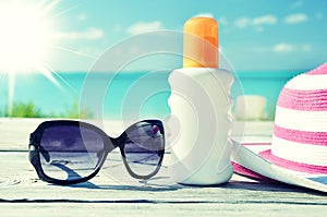 Sun lotion and sunglasses