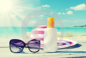 Sun lotion and sunglasses