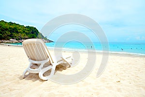 Sun lounger by a sandy beach photo