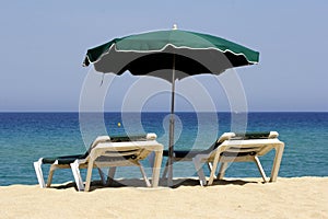 Sun lounger on sandy beach, co