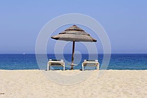 Sun lounger on sandy beach, co