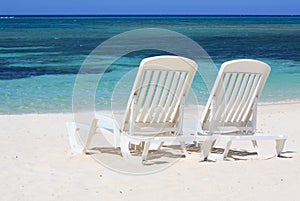 Sun loungers facing the Caribbean Sea