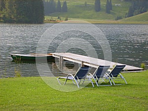 Sun loungers by lake