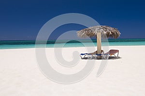 Sun loungers on tropical beach