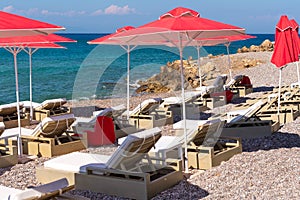 Sun loungers with umbrellas on Ellie beach