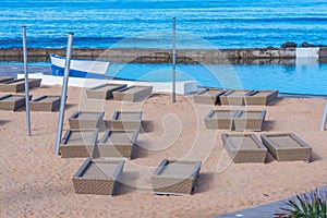 Sun Lounges at Playa de las americas at Tenerife, Canary islands, Spain photo