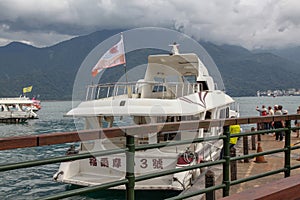 Sun moon lake ,Taiwan-October 13,2018:The ferry speed boat at the Sun Moon Lake harbour .Tourist are used to ferry passengers to 3