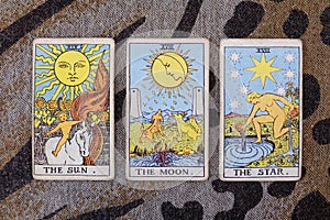Sun, moon, star tarot cards.