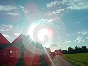 Sun over a house