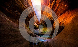 Sun over narrow slot canyon Lake Powell Utah