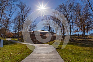 Sun over a trail in Heartland of America Park Omaha Nebraska USA.