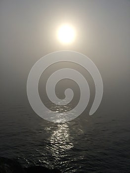 Sun over the water in the mist.Spring2017