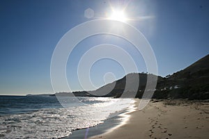 Sun overlooking West Coast beach