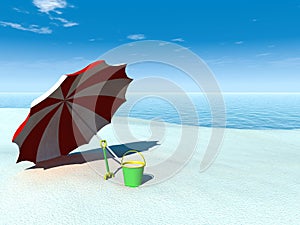 Sun parasol, bucket and spade on a beach.