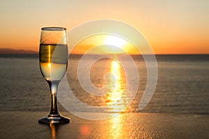 Sun path on the water, afternoon, one, single wineglass