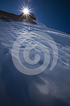 Sun on peak of mountain