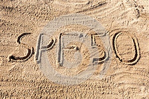 Sun protect factor fifty concept. SPF 50 word written on the beach