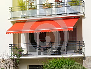 Sun protection awning at French balcony photo