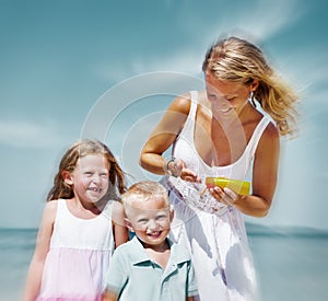 Sun protection on the Beach Mother Son Daughter Concept