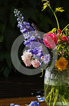 Sun after rain - colorful flowers bouquet in the garden