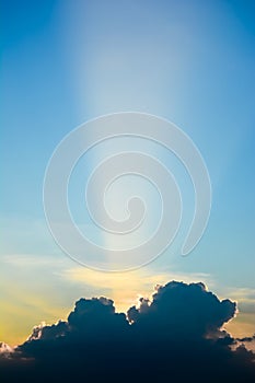 Sun ray shine through dark cloud in the sky.