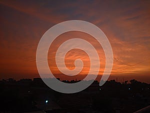 Sun rays beetween the clouds in a sunset sky.