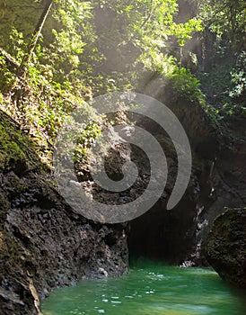 Sun rays in a cave on river. Jamaica