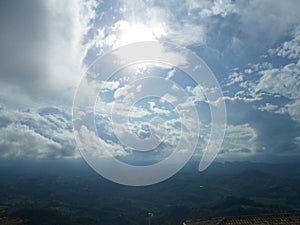 Sun rays, clouds and hills of San Marino