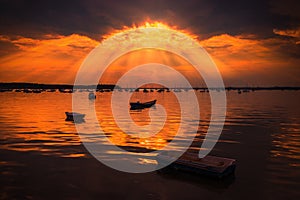 Sun rays illuminate boats in Poole Harbour