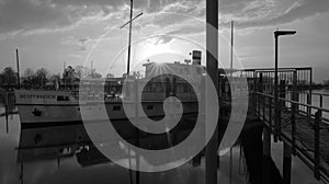 Sun rays over Historic ship Austria in Bregenz on Lake Constance in black and white