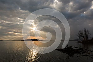 Sun rays over a lake