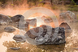 Sun reflecing on the Hot spring at national park during sunrise